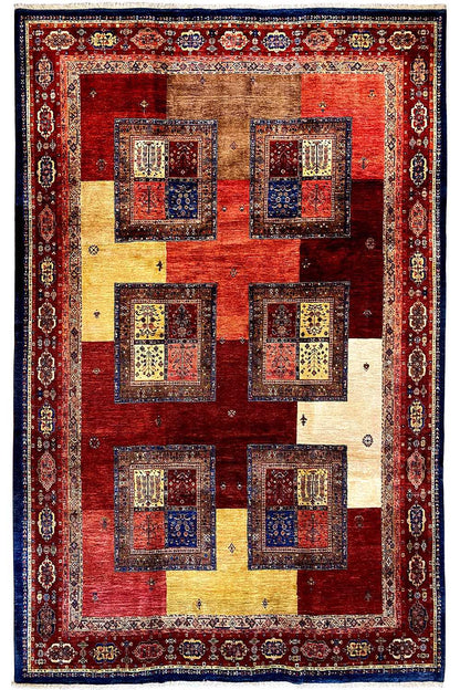 Vintage-style rug: red field with beige and blue squares, surrounded by a border