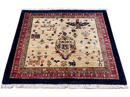 Rug with a beige center, red border and dark edging, light-colored fringes.