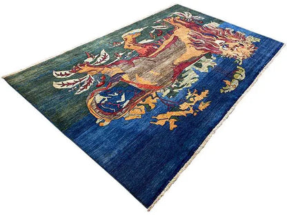 Blue oriental rug with a central equestrian figure and animal motifs, photographed diagonally