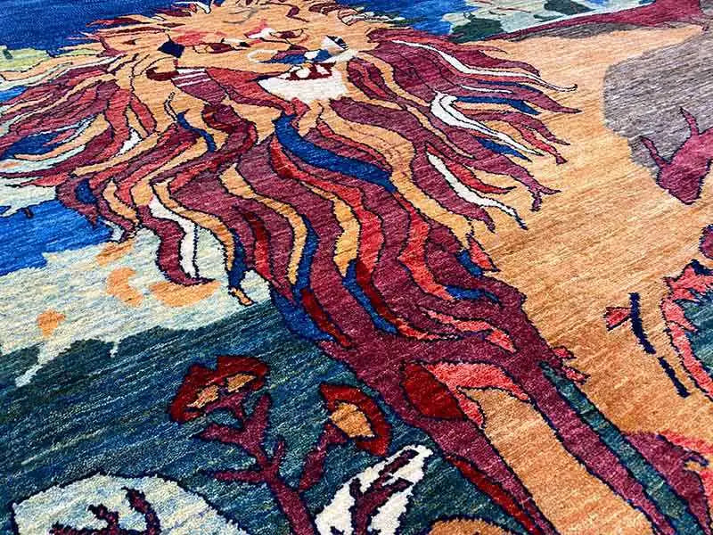 Close-up: carpet detail with a colorful lion motif and dense pile