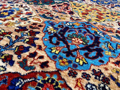 Close-up of a floral ornamental pattern in blue, red, and beige