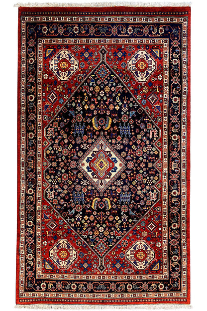 Rug with a red field, black central medallion, and blue-patterned borders