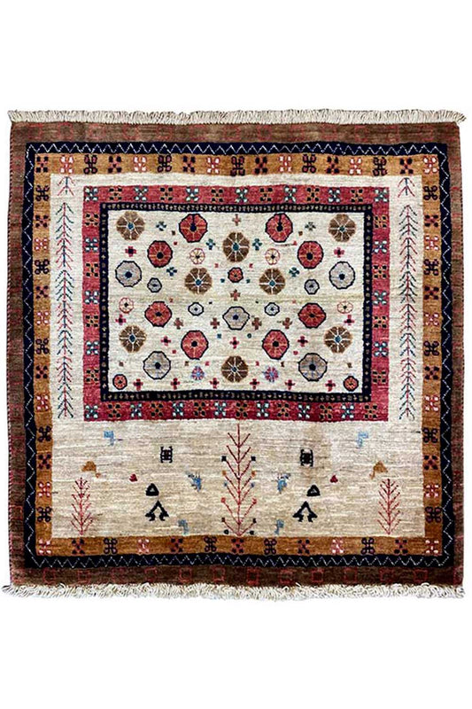 Rug with a rectangular border, a white-and-beige center, and colorful symbols