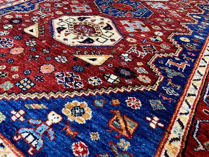 Carpet (144x98 cm) detail with a dense red-and-blue pattern and beige medallions