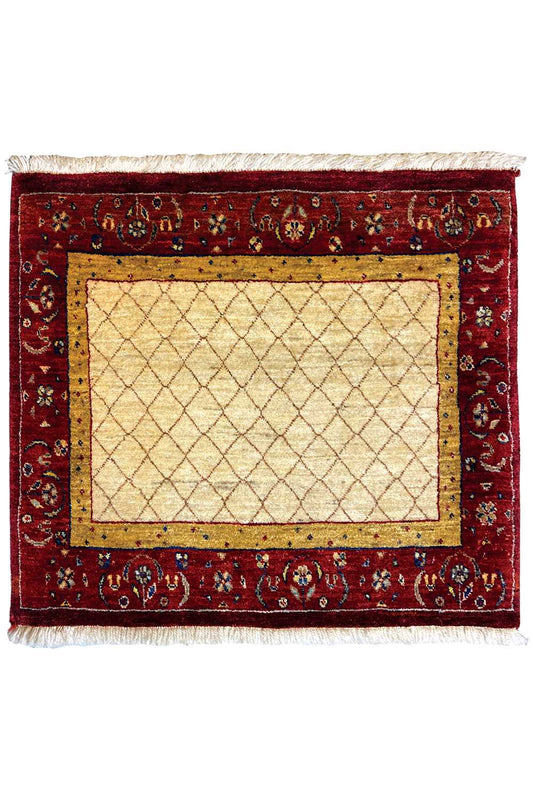 Carpet with a red decorative border and beige rectangular pattern, even pile, front view.