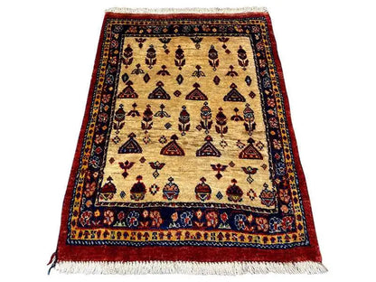 Rug with a beige background, dark border, geometric patterns, and fringe at the bottom