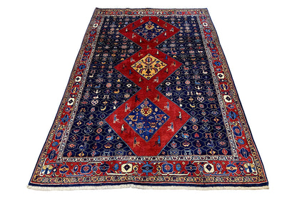 Blue-red oriental rug in oblique view, red central field and border