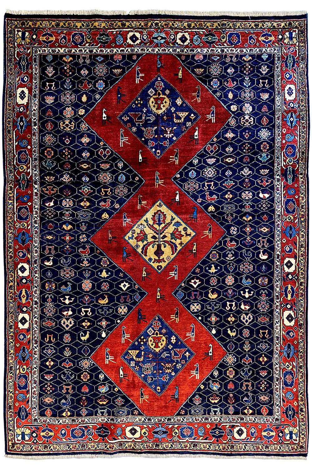 Blue-red Oriental rug with a large red medallion and surrounding border