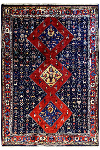 Blue-red Oriental rug with a large red medallion and surrounding border