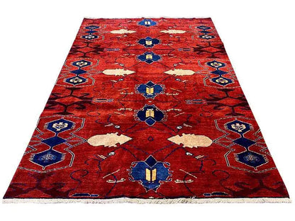 Red rug with a blue and beige pattern, large rectangular shape, 272x188 cm