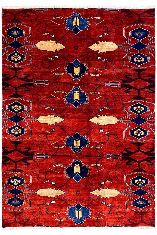 Red rectangular rug with a symmetrical blue and beige ornamental pattern