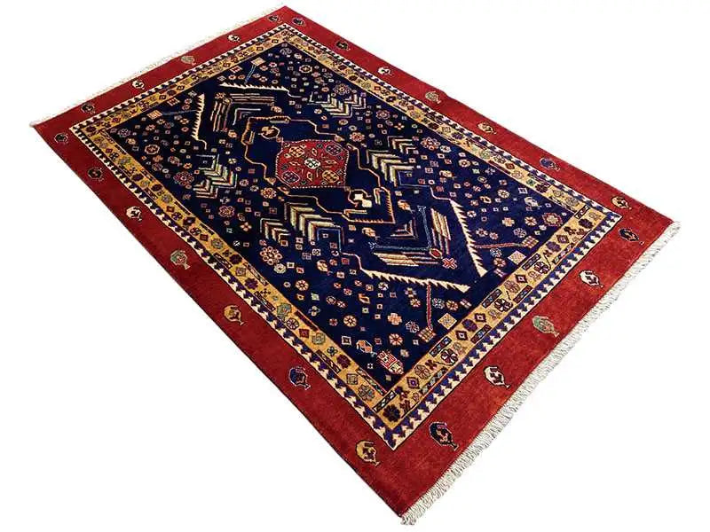 Square rug with a dark blue field, red border, and delicate pattern.
