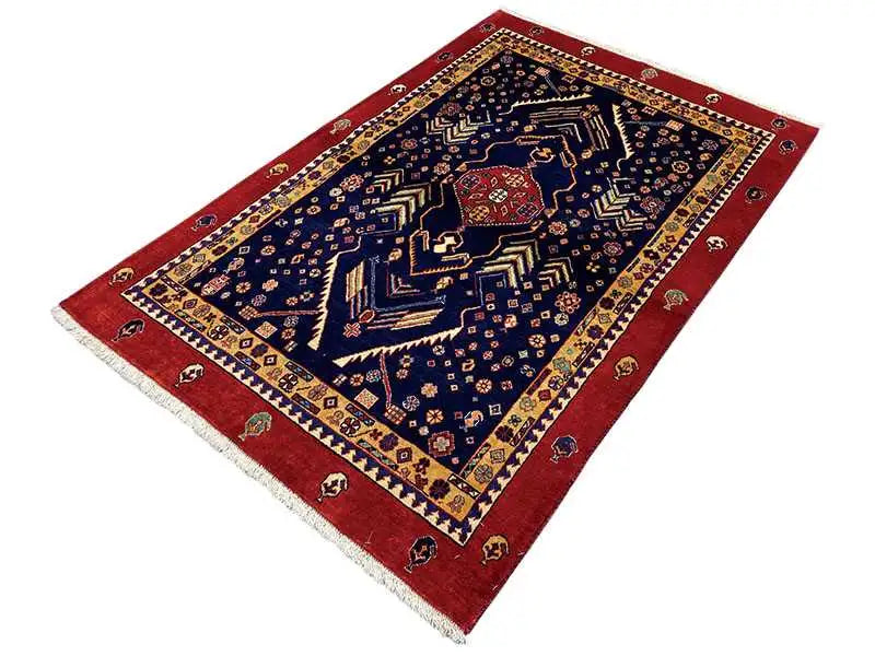 Dark blue carpet with a red trim, central ornament, and decorative border.