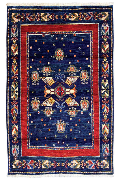 Rug: dark blue with a red inner border, symmetrical medallion and border pattern