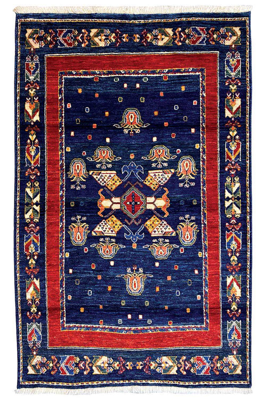 Rug: dark blue with a red inner border, symmetrical medallion and border pattern