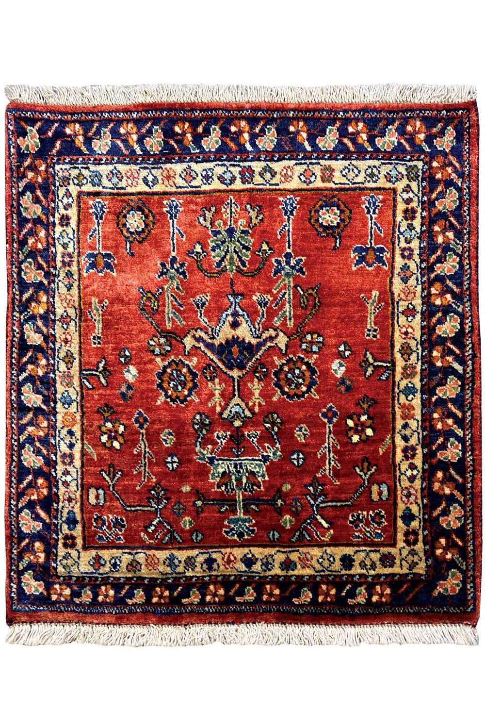 Square rug with a red central medallion, blue border, and fringe