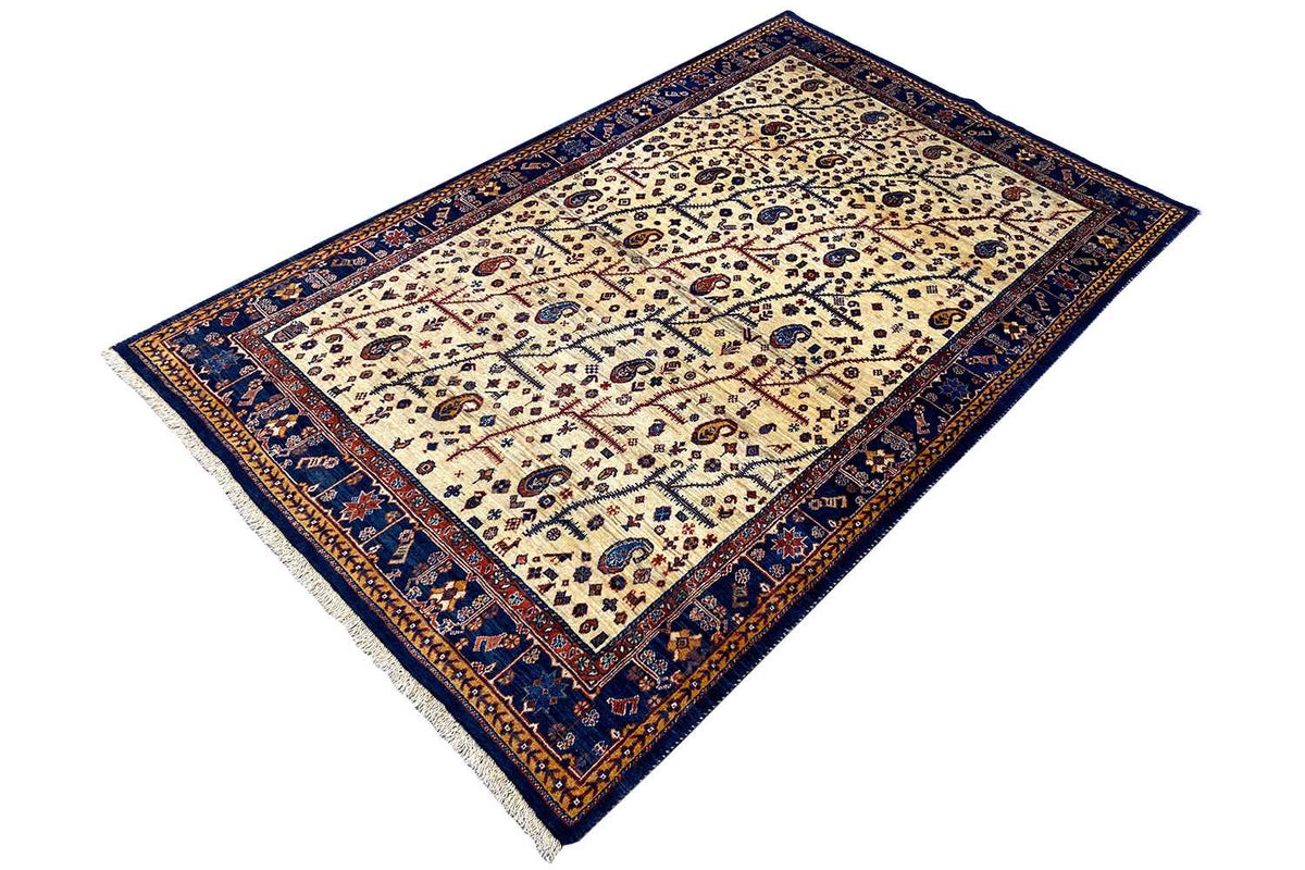 Qashqai rug with blue corner border and ornamental pattern on a light background