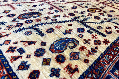 Close-up: Ornamental pattern on a light carpet background with a blue border