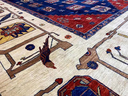 Carpet detail with delicate patterns in blue, red, cream, and brown
