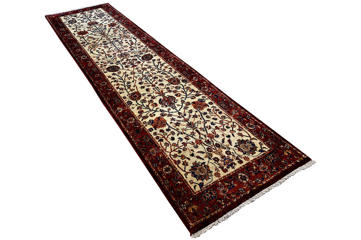 Oriental rug lying horizontally with a detailed ornamental pattern and dark border