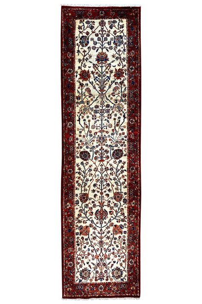 Oriental rug with medallion design, red border, and multicolored ornamental pattern