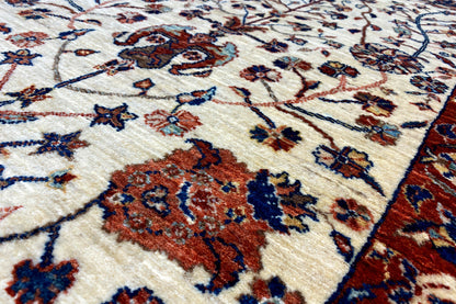 Qashqai exclusive carpet close-up, cream base with red and blue floral ornamentation