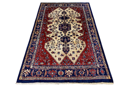 Qashqai Exclusive rectangular Oriental rug: cream-colored central motif, red field, blue borders