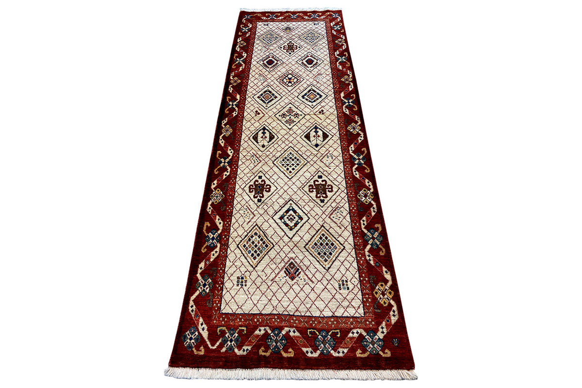 Exclusive Qashqai oriental rug, white-beige center with red border pattern, fringes