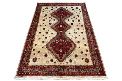 Beige carpet with a red central figure and border, slightly trapezoidal