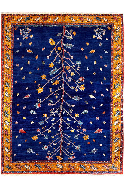 Rectangular Oriental rug: dark blue with a gold-orange border and delicate tree motif