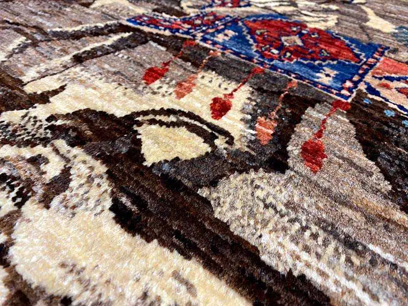 Qashqai exclusive rug close-up: blue-red ornament in a multicolored pattern