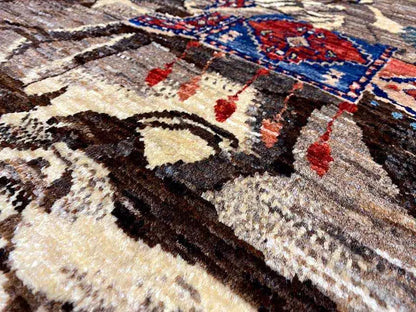 Qashqai exclusive rug close-up: blue-red ornament in a multicolored pattern