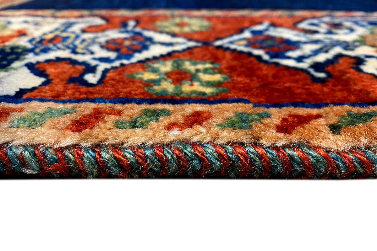 Carpet fringe at the edge: woven trim in blue, red, and turquoise