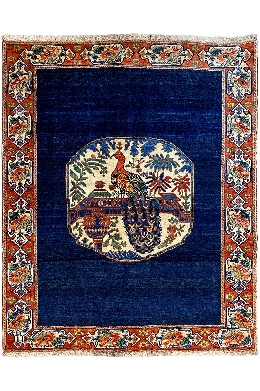 Blue rug 178x143 cm with red ornamental border and medallion design