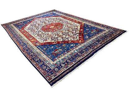 Oriental rug with a blue ground, red central medallion, and multicolored border