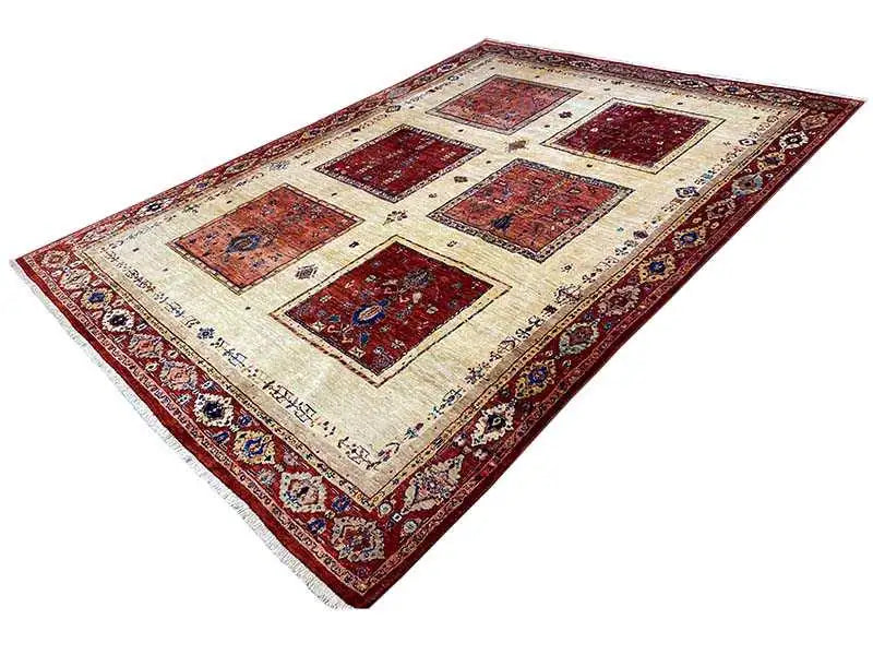 Oriental rug with square patterns in red and blue on a beige background