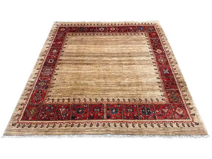 Beige oriental rug with a red border and ornamental frame, all-over pattern