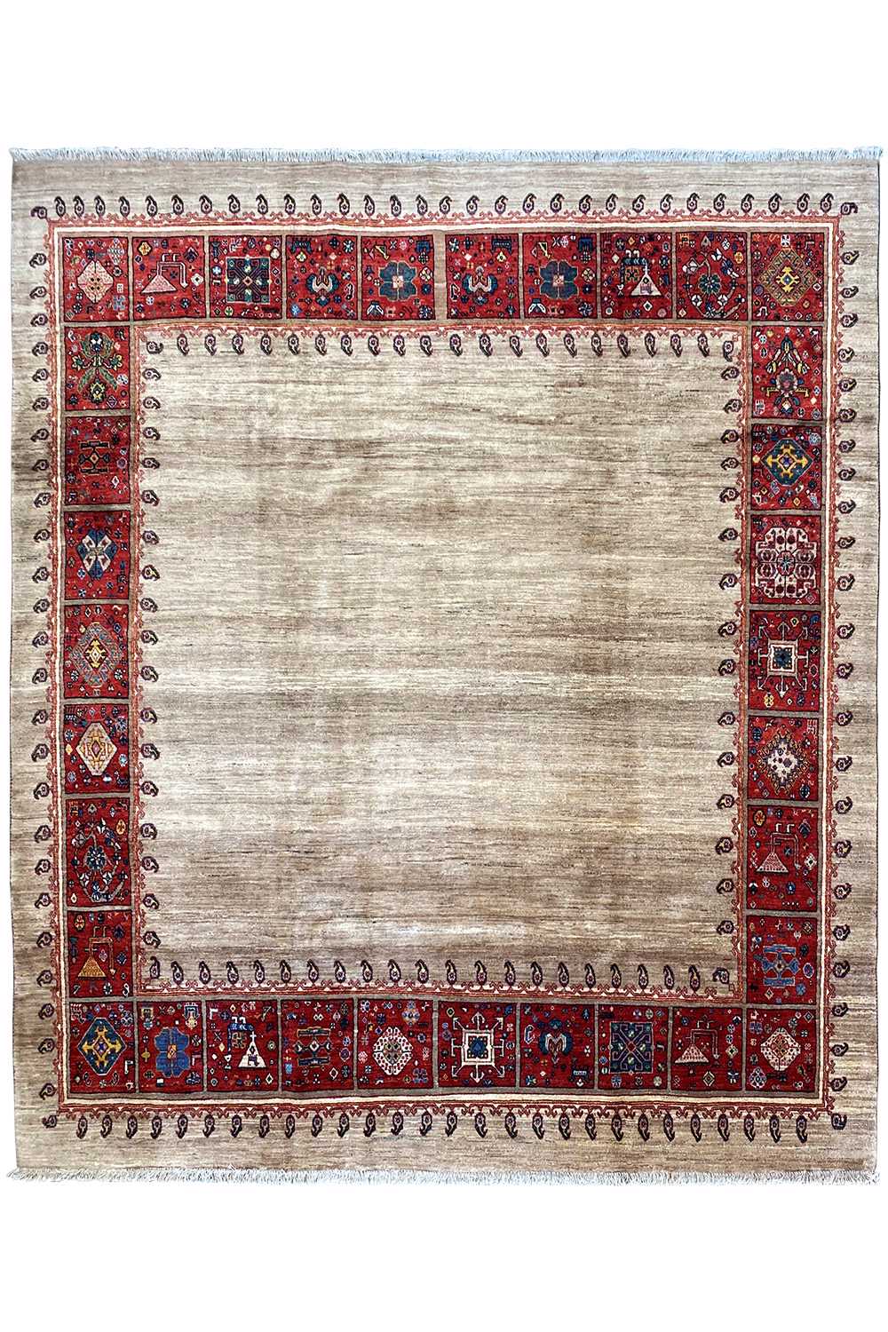 Oriental rug with a beige center and red border, decorative trim along the edge