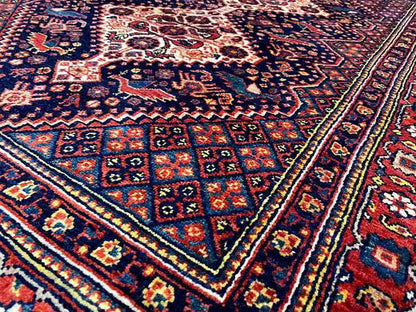 Qashqai Exclusive Rug Detail: geometric pattern in shades of blue, red, and yellow
