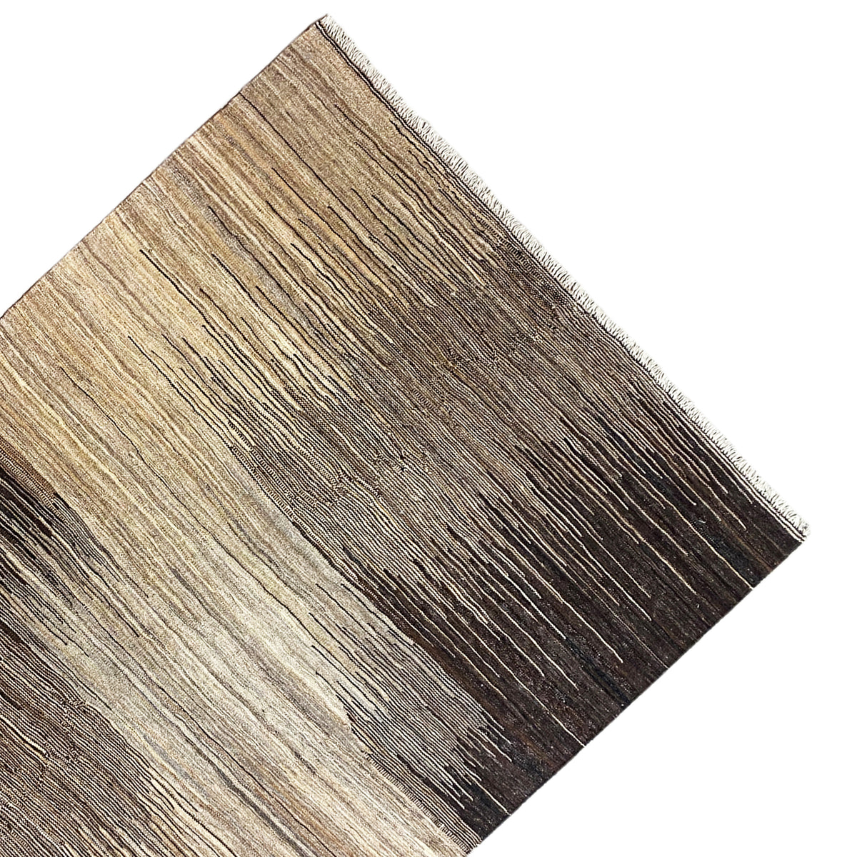 Kilim rug corner viewed at an angle, light beige and dark brown, frayed edge