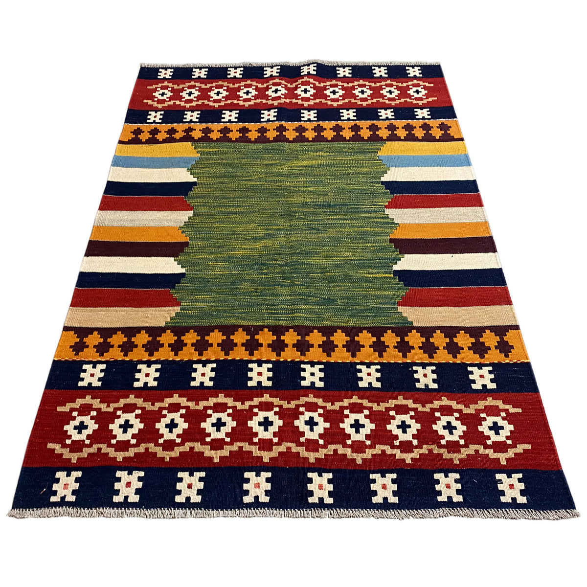 Flat-laid kilim rug with a green central motif and stripes in blue, red, and yellow