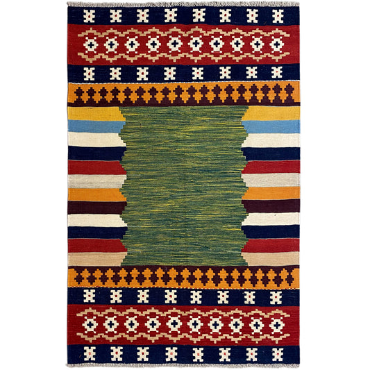 Kilim rug with a green central motif and geometric borders in blue, red, and beige