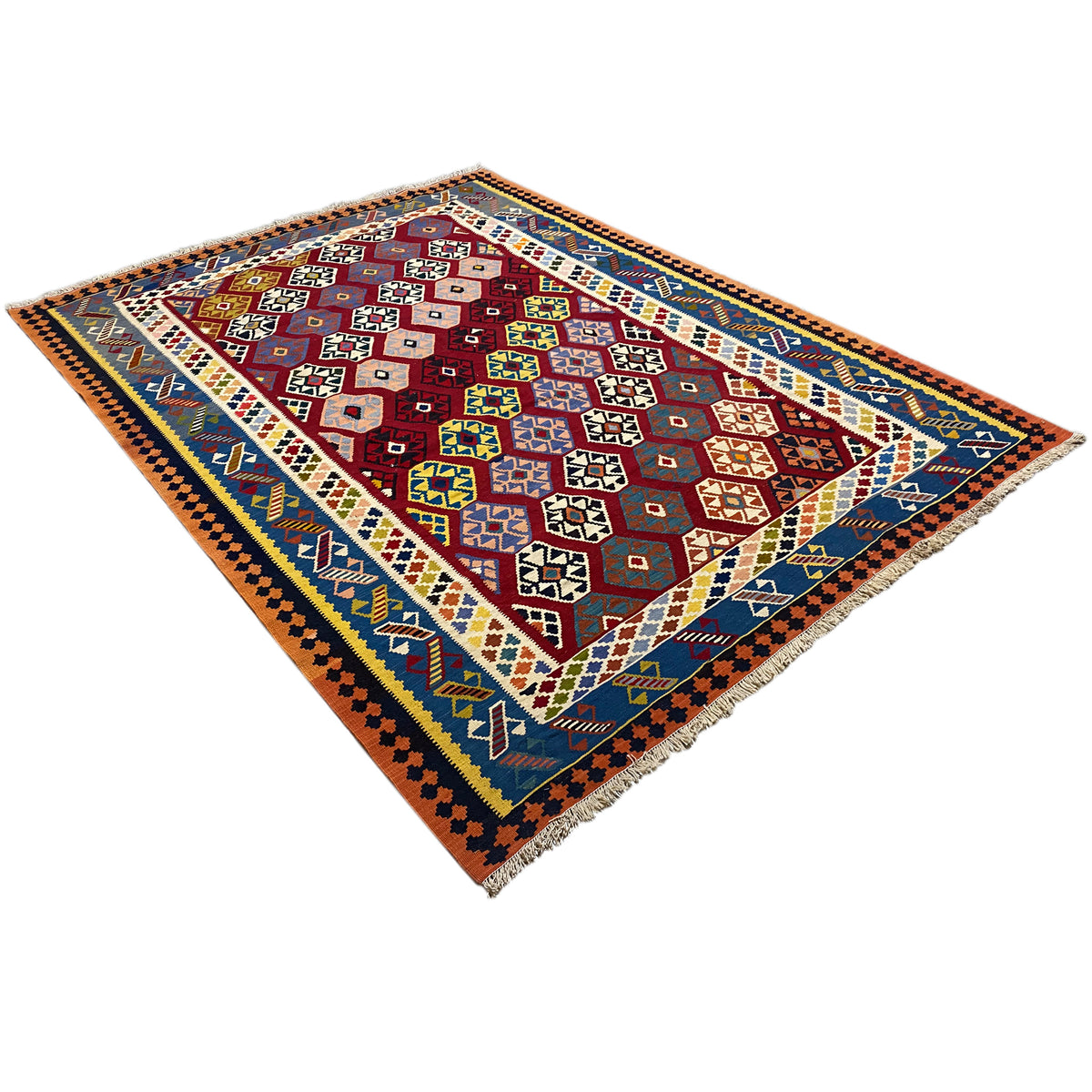 Qashqai kilim rug appearing square, diagonal view with red, blue, and yellow patterns
