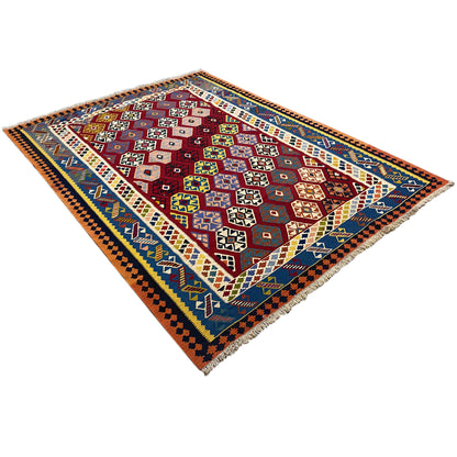 Qashqai kilim rug appearing square, diagonal view with red, blue, and yellow patterns
