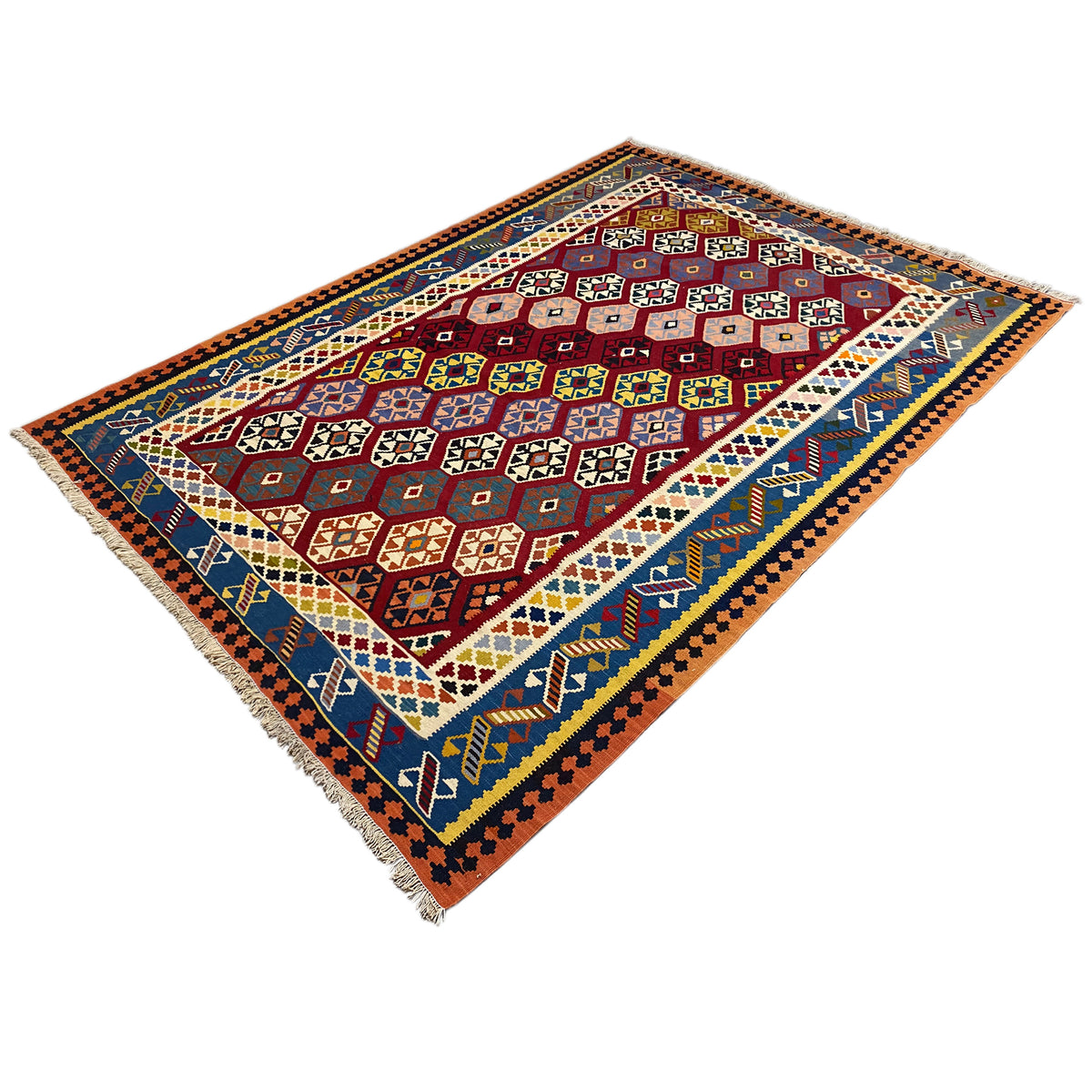 Qashqai kilim rug, diagonal view with a geometric central field and fringes along the edges