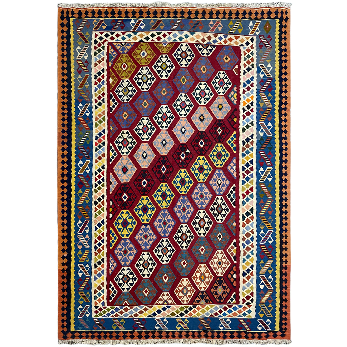 Rectangular Qashqai kilim rug with colorful geometric patterns in red, blue, and yellow