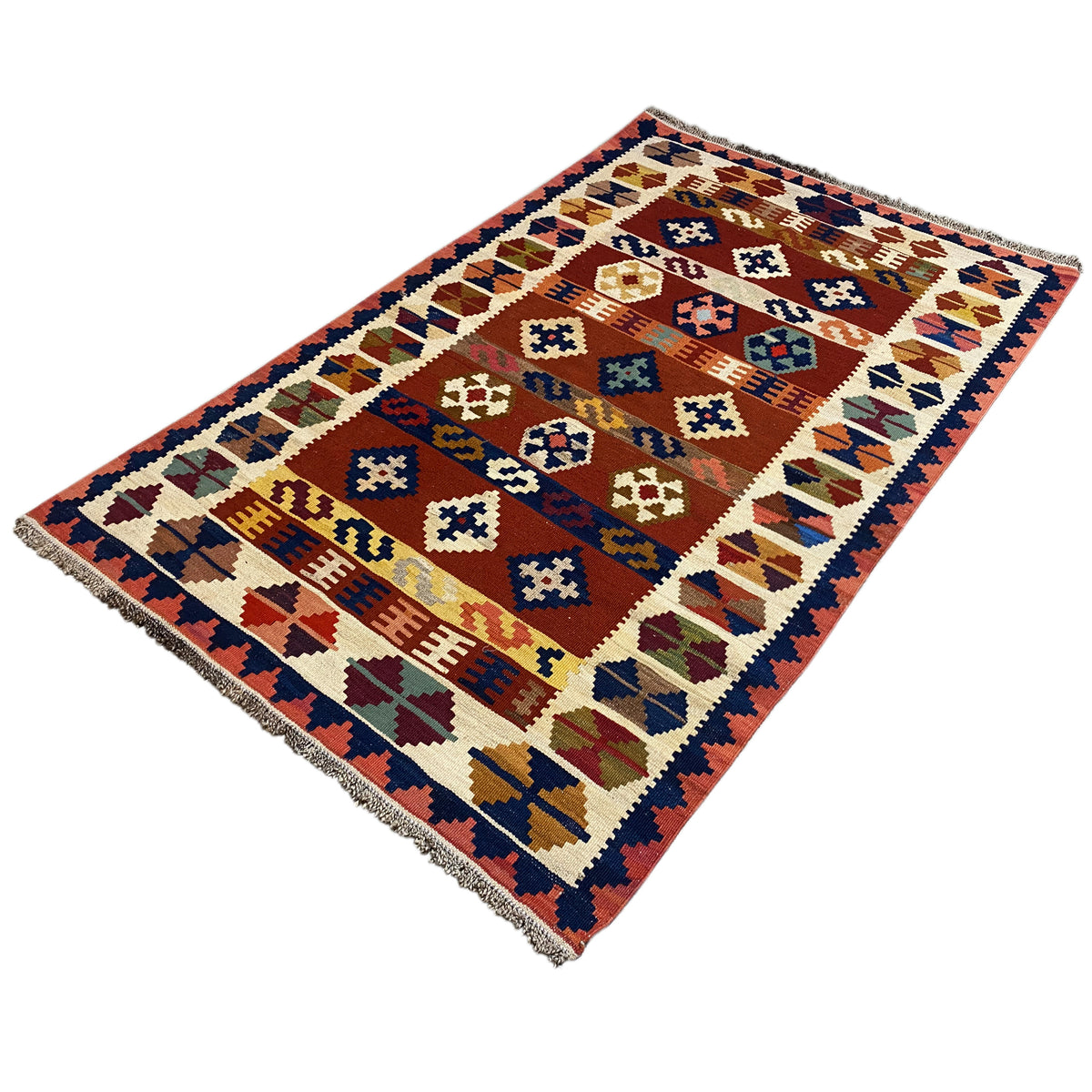 Kilim rug viewed from above with a clear border and colorful symbols.