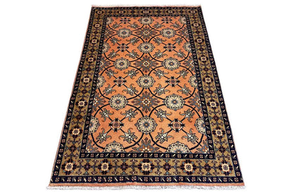Oriental rug 148x107 cm, lying flat: orange pattern with dark border