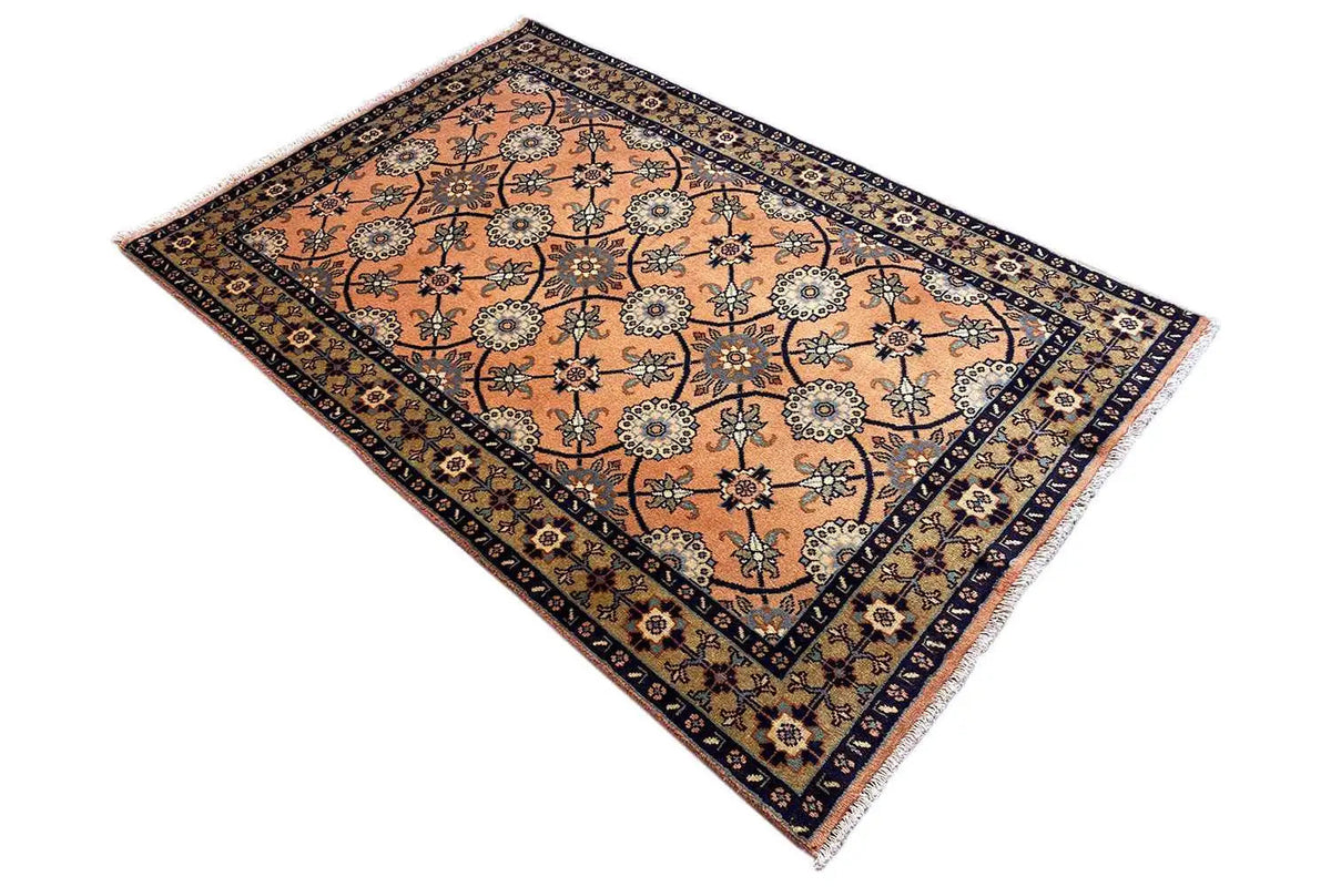 Oriental rug 148x107 cm, view from the corner: orange ornamental pattern, dark border