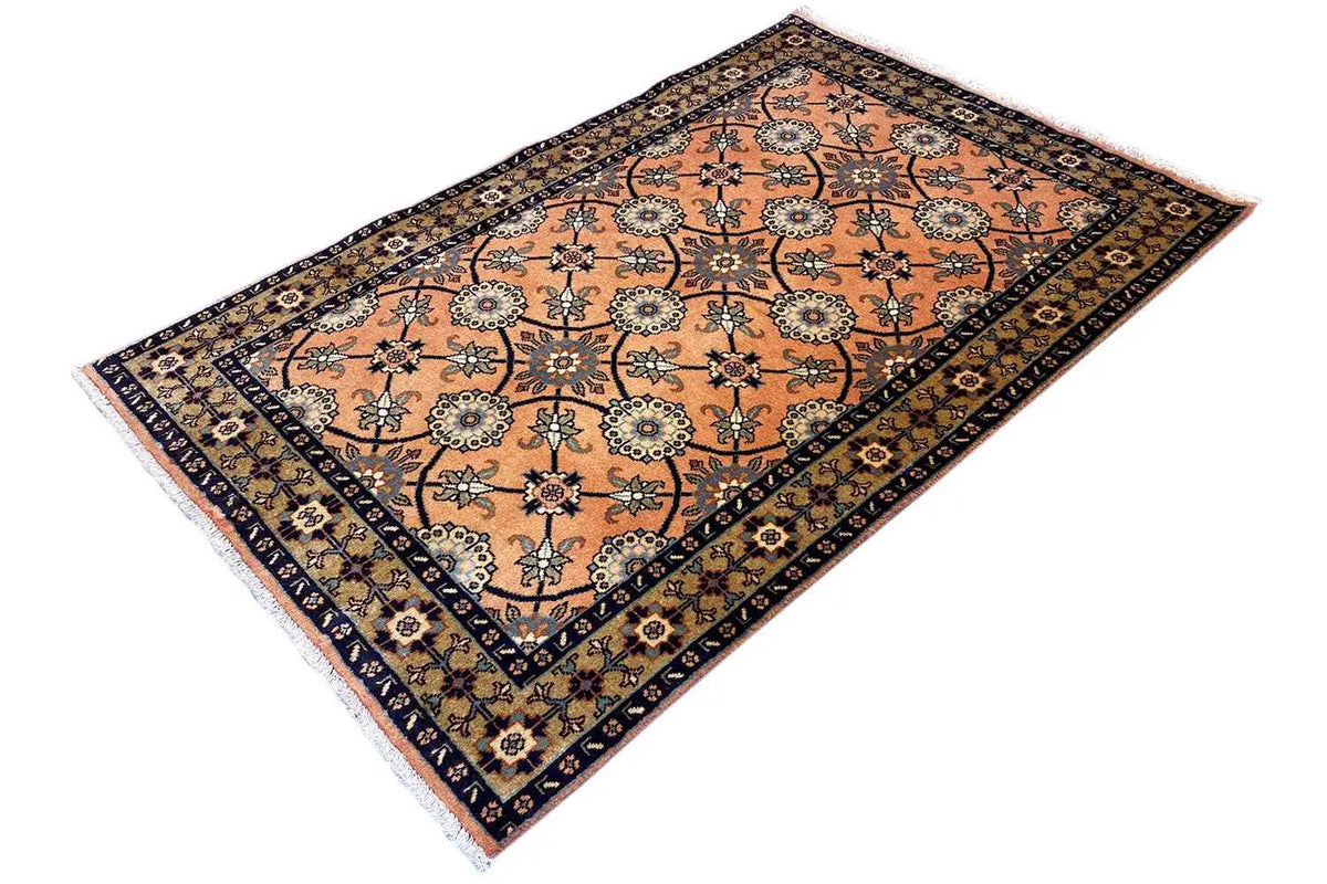 Oriental rug 148x107 cm, angled view: orange medallions with a dark blue border line